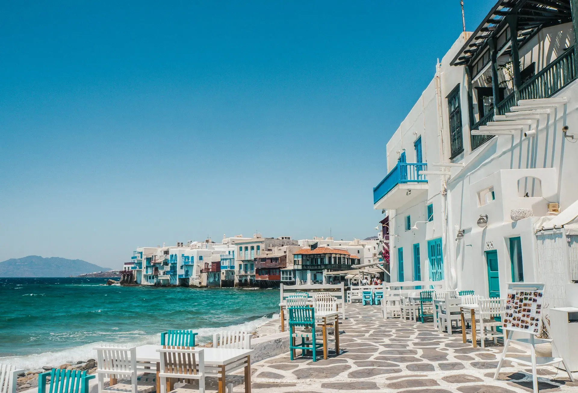 white and brown concrete buildings near sea during daytime