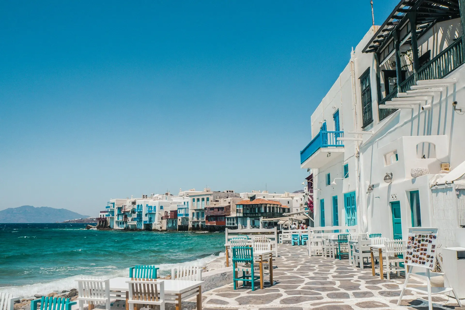 white and brown concrete buildings near sea during daytime